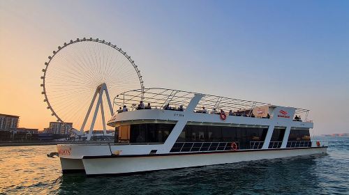 Luxury Dubai Sunset & Dinner Cruise (90min) on Glass Boat with International Buffet & Live Music Transport Passes